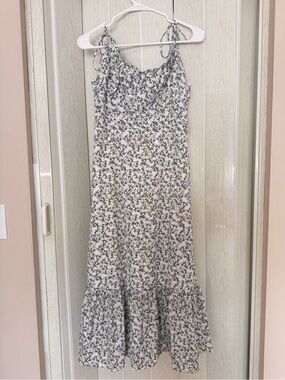 Aqua blue floral midi dress with adjustable straps and ruffle hem